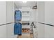 Organized walk-in closet with shelving, hanging rods and wicker baskets for storage solutions at 6210 Sun Blvd # 206, St Petersburg, FL 33715