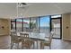 Dining area featuring a large table, multiple chairs, and a view of the waterway at 6210 Sun Blvd # 206, St Petersburg, FL 33715