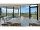 Dining area features a large table, multiple chairs, and a view of the golf course at 6210 Sun Blvd # 206, St Petersburg, FL 33715
