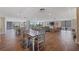Large dining area featuring multiple tables, views of golf course, and lounge area at 6210 Sun Blvd # 206, St Petersburg, FL 33715
