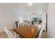 Inviting dining area featuring a wood table, comfortable seating, and sliding door to outside view at 6210 Sun Blvd # 206, St Petersburg, FL 33715
