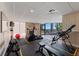 Gym features weight equipment, elliptical machine, mirror, and a view of the waterway at 6210 Sun Blvd # 206, St Petersburg, FL 33715