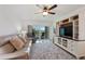 Serene living room featuring a balcony with view, custom built-ins, and a relaxing ambiance at 6210 Sun Blvd # 206, St Petersburg, FL 33715