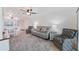 Spacious open-concept living area with comfortable seating, dining area, and plenty of natural light at 6210 Sun Blvd # 206, St Petersburg, FL 33715