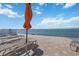 Enjoy breathtaking bay views while lounging on the paver patio with relaxing lounge chairs and sun umbrella at 6210 Sun Blvd # 206, St Petersburg, FL 33715
