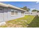 Backyard featuring a storage shed and an attached home at 1035 S Duncan Ave, Clearwater, FL 33756
