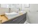 Modern bathroom featuring dual vessel sinks, wood vanity, and chrome fixtures at 1035 S Duncan Ave, Clearwater, FL 33756