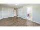 This large bedroom features laminate wood flooring, neutral paint, and ample closet space at 1035 S Duncan Ave, Clearwater, FL 33756