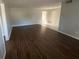 Inviting living room and dining area with hardwood floors, ample natural light, and neutral wall colors at 1035 S Duncan Ave, Clearwater, FL 33756