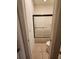 A narrow bathroom features a shower-tub combo behind a sliding glass door at 1829 Mira Lago Cir, Ruskin, FL 33570