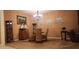 Formal dining room featuring carpet, chandelier, and elegant decor at 1829 Mira Lago Cir, Ruskin, FL 33570