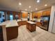 Large kitchen features an island, stainless steel appliances and lots of cabinetry at 1829 Mira Lago Cir, Ruskin, FL 33570