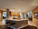 This kitchen features a breakfast bar, wood cabinets, and stainless appliances at 1829 Mira Lago Cir, Ruskin, FL 33570