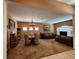 Spacious formal living room featuring a chandelier and comfortable seating arrangement at 1829 Mira Lago Cir, Ruskin, FL 33570