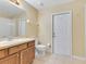 Bathroom featuring a vanity with a sink, toilet, and shower at 14256 Salvatierra Ln, Port Charlotte, FL 33981