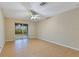 Bright bedroom with sliding glass doors leading to the outdoors and ceiling fan at 14256 Salvatierra Ln, Port Charlotte, FL 33981