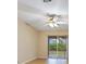Bright bedroom with sliding glass doors leading to the outdoors and ceiling fan at 14256 Salvatierra Ln, Port Charlotte, FL 33981