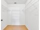 Walk-in closet with open shelving and tile floor at 14256 Salvatierra Ln, Port Charlotte, FL 33981