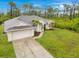 Charming single-Gathering home with well-maintained landscaping and inviting curb appeal at 14256 Salvatierra Ln, Port Charlotte, FL 33981