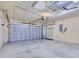 Spacious two-car garage featuring an automatic door and ample storage space at 14256 Salvatierra Ln, Port Charlotte, FL 33981
