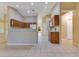 Bright kitchen area with bar seating, wood cabinets and white appliances at 14256 Salvatierra Ln, Port Charlotte, FL 33981