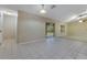 Spacious living room with tiled flooring, sliding doors, and bright natural light at 14256 Salvatierra Ln, Port Charlotte, FL 33981