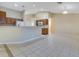 Open-concept living room with tile flooring adjacent to the kitchen area at 14256 Salvatierra Ln, Port Charlotte, FL 33981