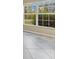 Neutral tiled flooring, a window with exterior views, and an open floor plan contribute to a welcoming home at 14256 Salvatierra Ln, Port Charlotte, FL 33981