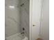 Bathroom with white marble-like tile in the shower and gold hardware at 14914 San Domingo Blvd, Port Charlotte, FL 33981