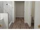 Bathroom features a walk-in shower, white marbled walls, and modern fixtures at 14914 San Domingo Blvd, Port Charlotte, FL 33981