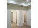 Bedroom features laminate wood flooring, bright white walls, and ample closet space at 14914 San Domingo Blvd, Port Charlotte, FL 33981