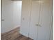 Bedroom with wood flooring and a double door closet with gold handles at 14914 San Domingo Blvd, Port Charlotte, FL 33981
