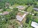 Aerial view capturing a home's position in a lush neighborhood, also showing a new construction project nearby at 14050 Blackjack Rd, Dover, FL 33527