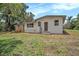 The backyard is surrounded by beautiful landscaping and offers an additional deck and separate entrance at 14050 Blackjack Rd, Dover, FL 33527