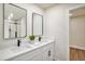 Modern bathroom with double sinks, quartz countertops, and black hardware at 14050 Blackjack Rd, Dover, FL 33527