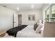 Bright bedroom featuring a comfortable bed, soft pillows, and a cozy blanket at 14050 Blackjack Rd, Dover, FL 33527