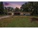Charming single story home with an attached garage and a landscaped front yard at 14050 Blackjack Rd, Dover, FL 33527