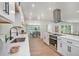 This bright kitchen has stainless steel appliances, quartz countertops, and modern finishes at 14050 Blackjack Rd, Dover, FL 33527