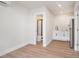 Open-concept living space with wood floors, a kitchenette, and a bathroom at 14050 Blackjack Rd, Dover, FL 33527