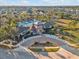 Aerial view of Cypress Creek community amenities, featuring a pool, clubhouse, and lush landscaping throughout the neighborhood at 8506 Hunters Fork Loop, Ruskin, FL 33573