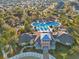 Overhead view of the community's sprawling pool, playground, clubhouse, and surrounding trees at 8506 Hunters Fork Loop, Ruskin, FL 33573