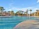 Spacious community pool with ample lounging areas and covered cabana spaces at 8506 Hunters Fork Loop, Ruskin, FL 33573