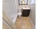 Updated bathroom with a shower, new vanity, tiled flooring, and a toilet at 3217 Deerfield Dr, Tampa, FL 33619