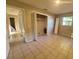 An empty bedroom featuring a walk in closet and tile flooring at 3217 Deerfield Dr, Tampa, FL 33619