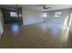 A large bonus room with tiled floor, windows and a ceiling fan at 3217 Deerfield Dr, Tampa, FL 33619