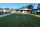 Charming single-story home with a well-maintained lawn and a covered front porch at 3217 Deerfield Dr, Tampa, FL 33619