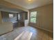 A spacious living room area with neutral paint, tiled floors and natural light at 3217 Deerfield Dr, Tampa, FL 33619