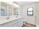 Elegant bathroom with double vanity, modern fixtures, and a sleek design at 19543 Midway Blvd, Port Charlotte, FL 33948