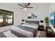 Comfortable bedroom with neutral tones, stylish decor, and large window providing natural light at 19543 Midway Blvd, Port Charlotte, FL 33948