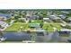 An aerial view highlighting the home's prime waterfront location and community at 24277 Treasure Island Blvd, Punta Gorda, FL 33955